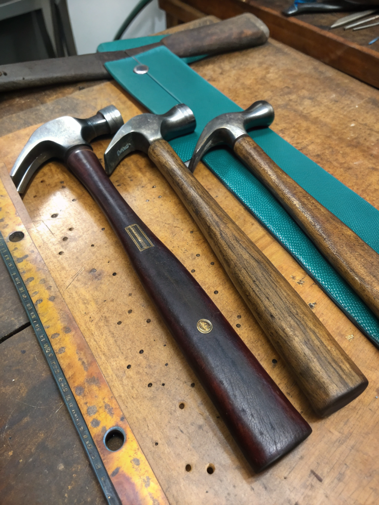 Vintage cobbler hammers, passed down through generations, ensuring precision in every strike.